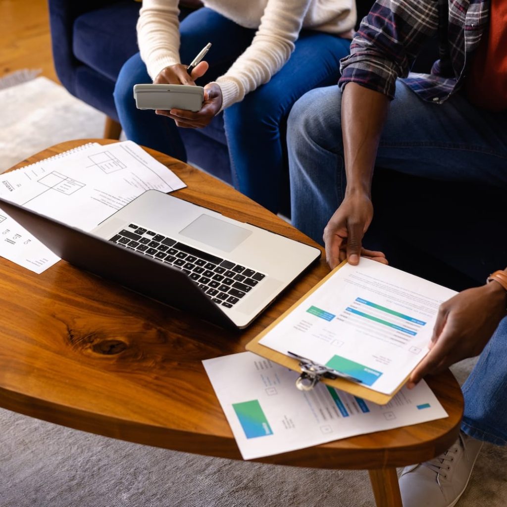 low-section-of-african-american-couple-doing-paper-2023-11-27-04-55-42-utc