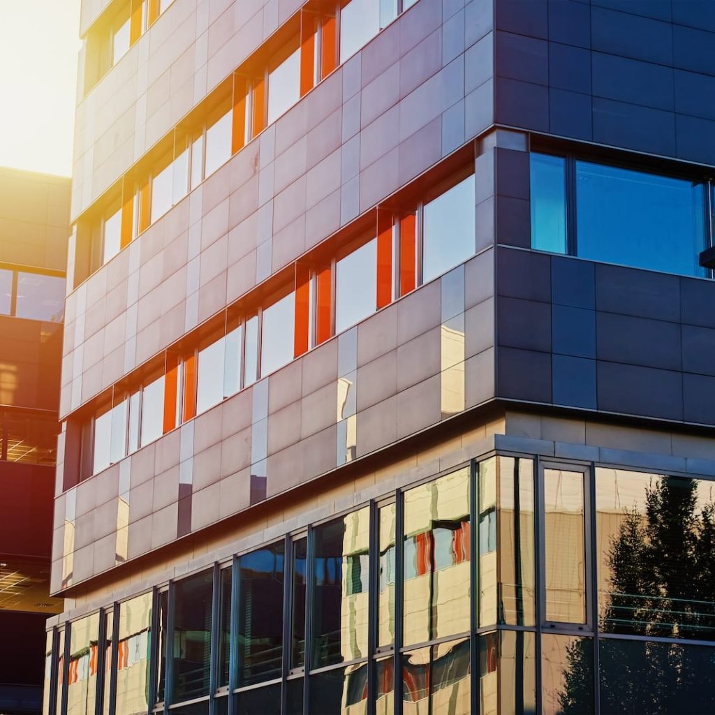 modern-office-building-with-green-trees-2023-11-27-05-34-00-utc